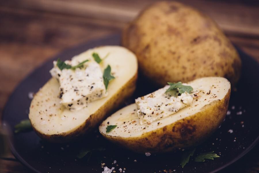 Healthy baked potatoes with cheese and herbs