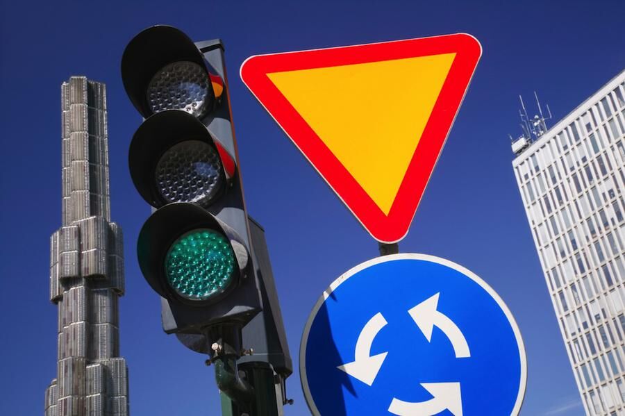Traffic signal and signs in Sergels Torg, Sweden.